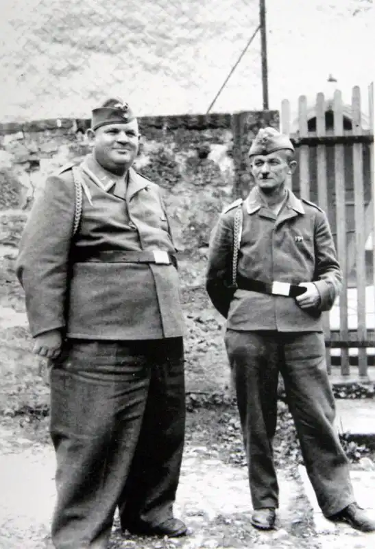 Two contrasting Luftwaffe airfield NCOs wearing Fliegerbluse tunics and Schützenschnur marksmanship lanyards in Germany 1944.