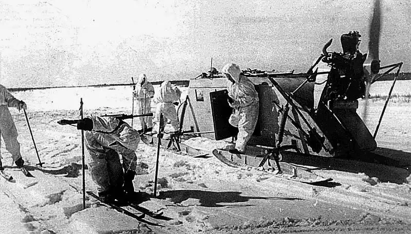 Soviet ski scouts in white winter camouflage disembark from NKL-16 aerosleds during a reconnaissance mission on the Eastern Front in winter 1942–1943.