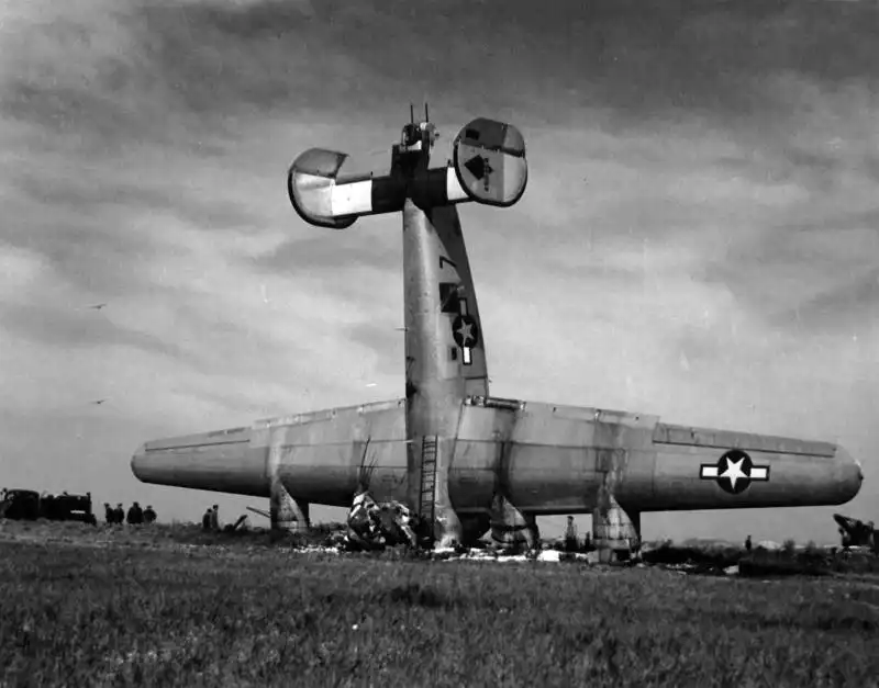 USAAF Consolidated B-24M Liberator bomber vertical nose-over crash site at San Giovanni airfield Italy 1945.