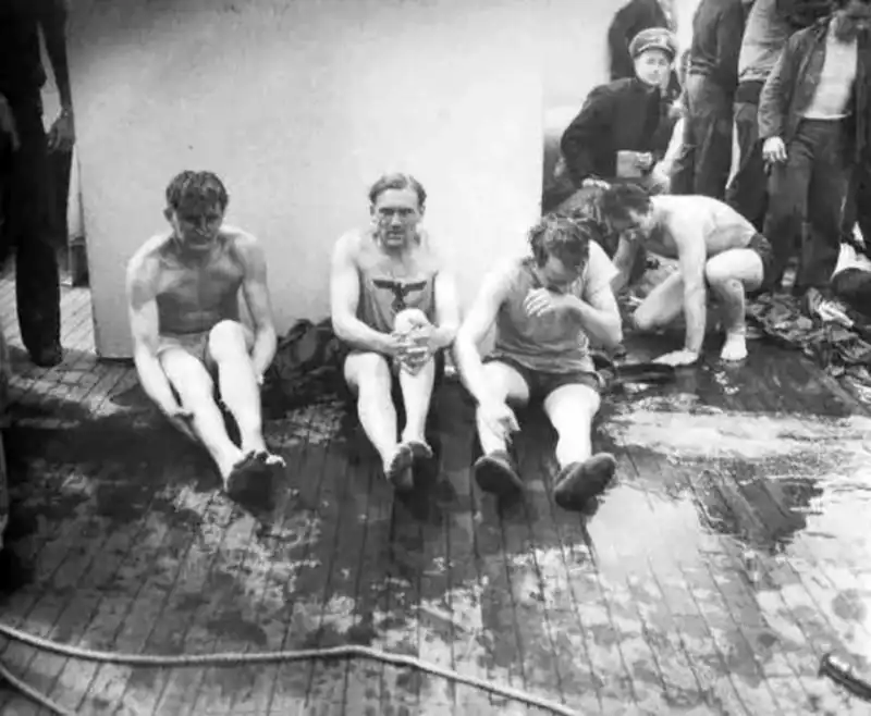 German submariners rescued from U-175 sitting wrapped in blankets aboard the American cutter Spencer in April 1943