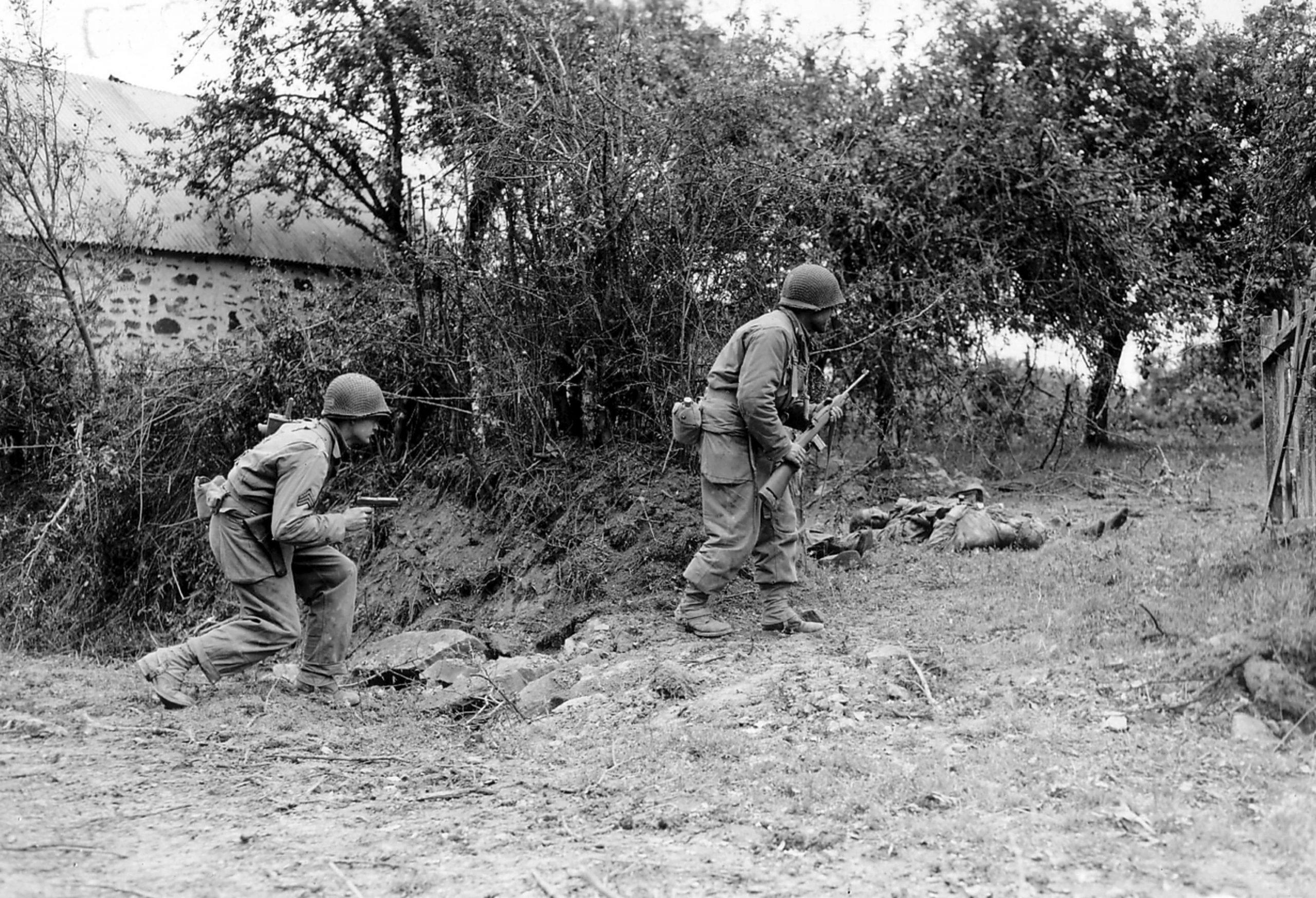 American soldiers in search of a German sniper at the Battle of Normandy