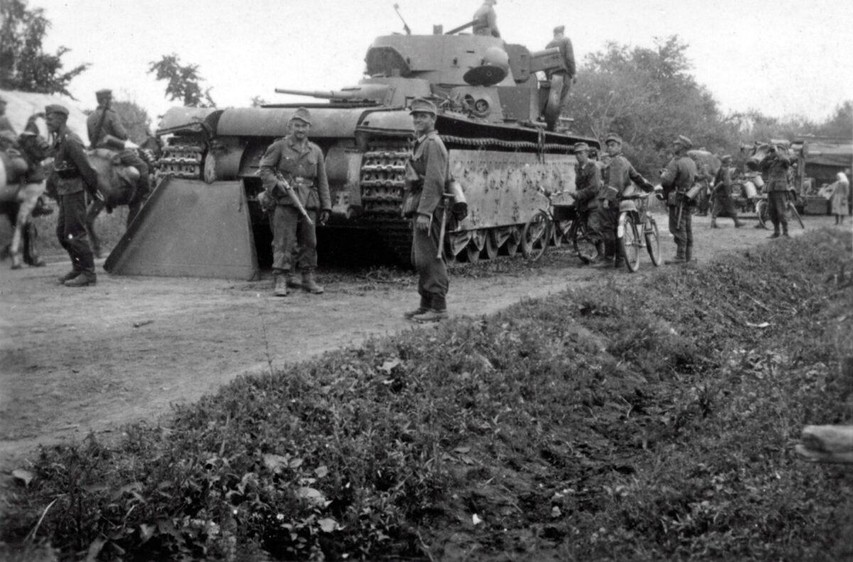German soldiers inspect the Soviet T-35 tank