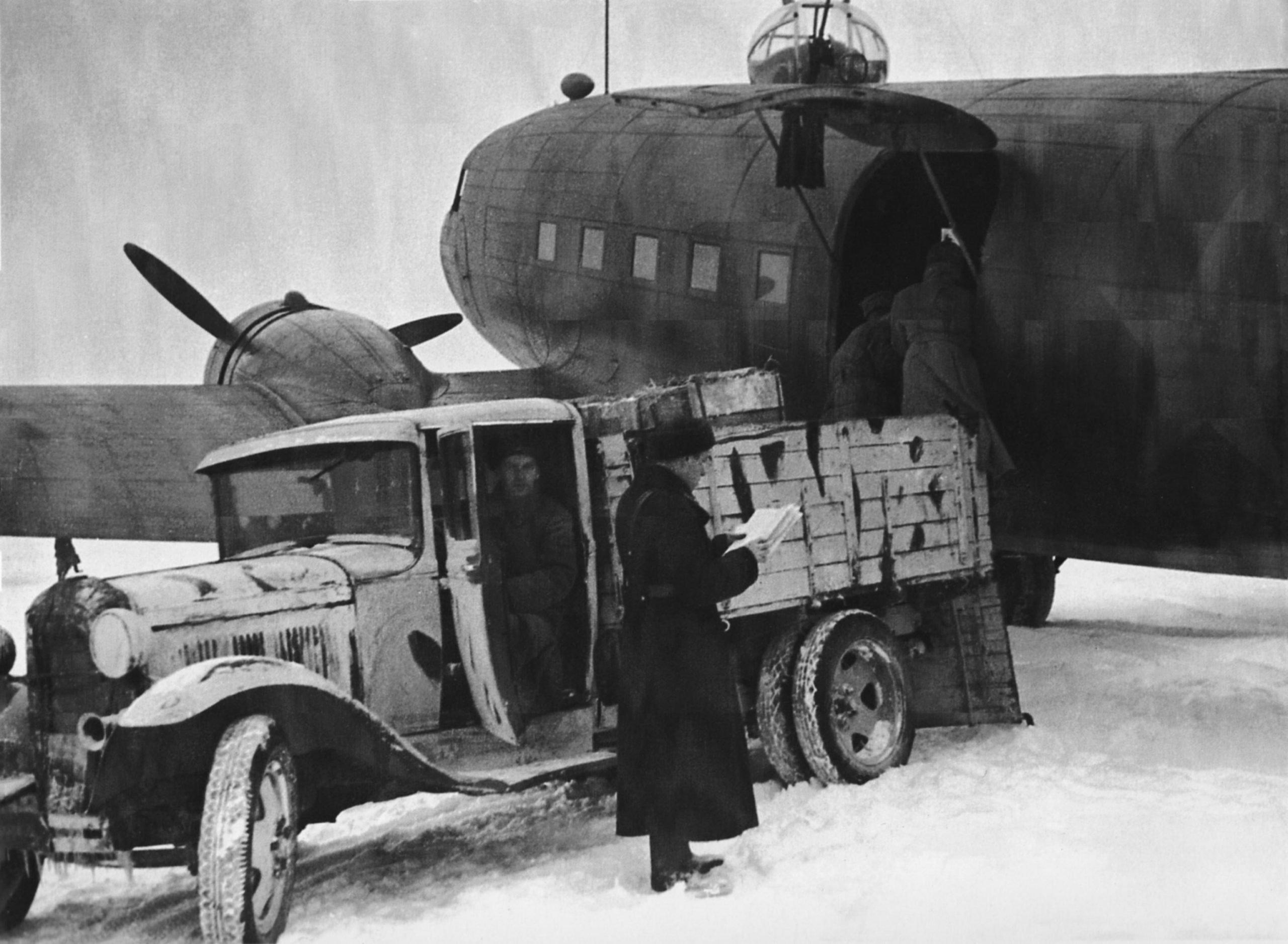 Unloading food for besieged Leningrad from a Soviet Li-2 transport aircraft