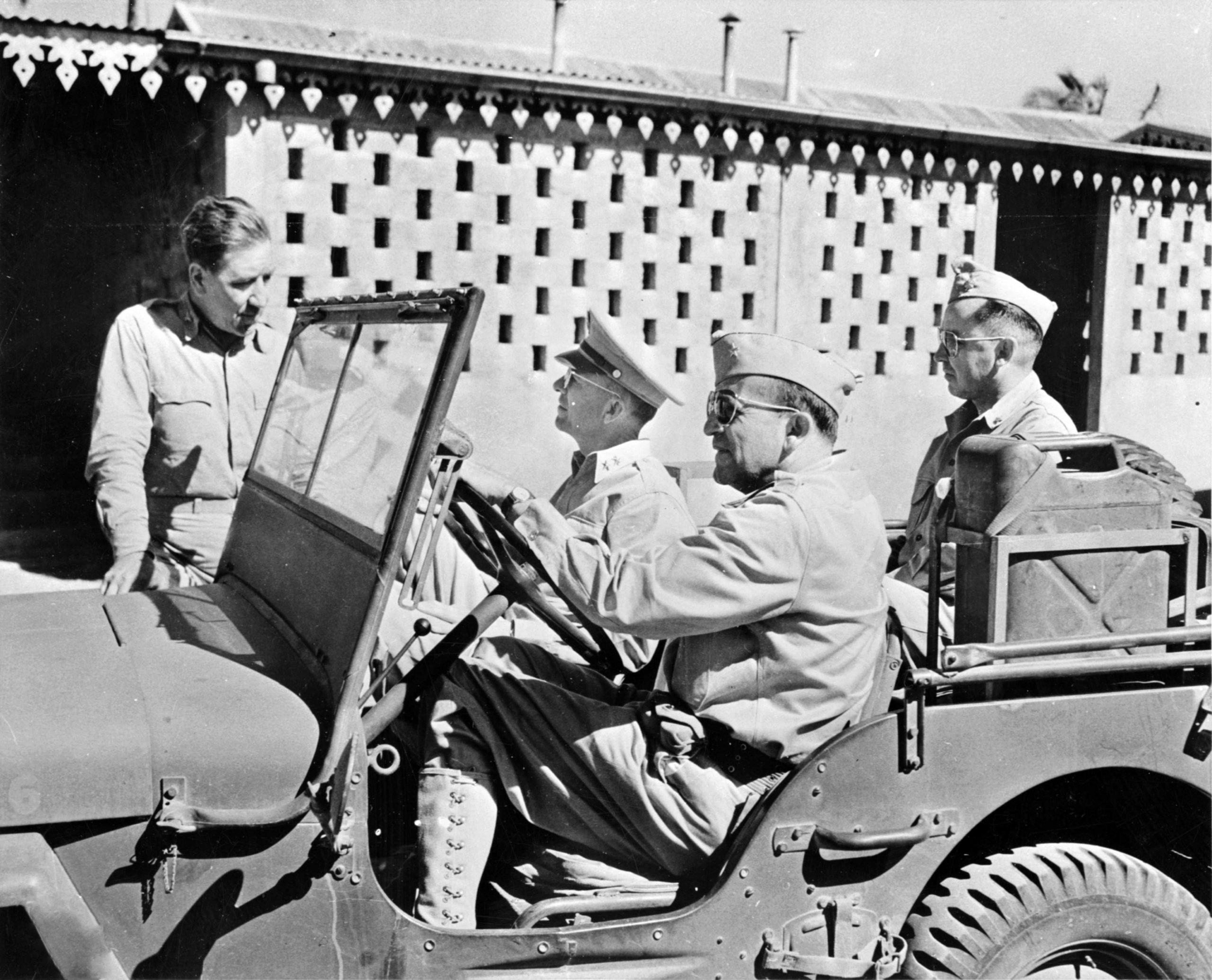American officers sit in a Willys jeep