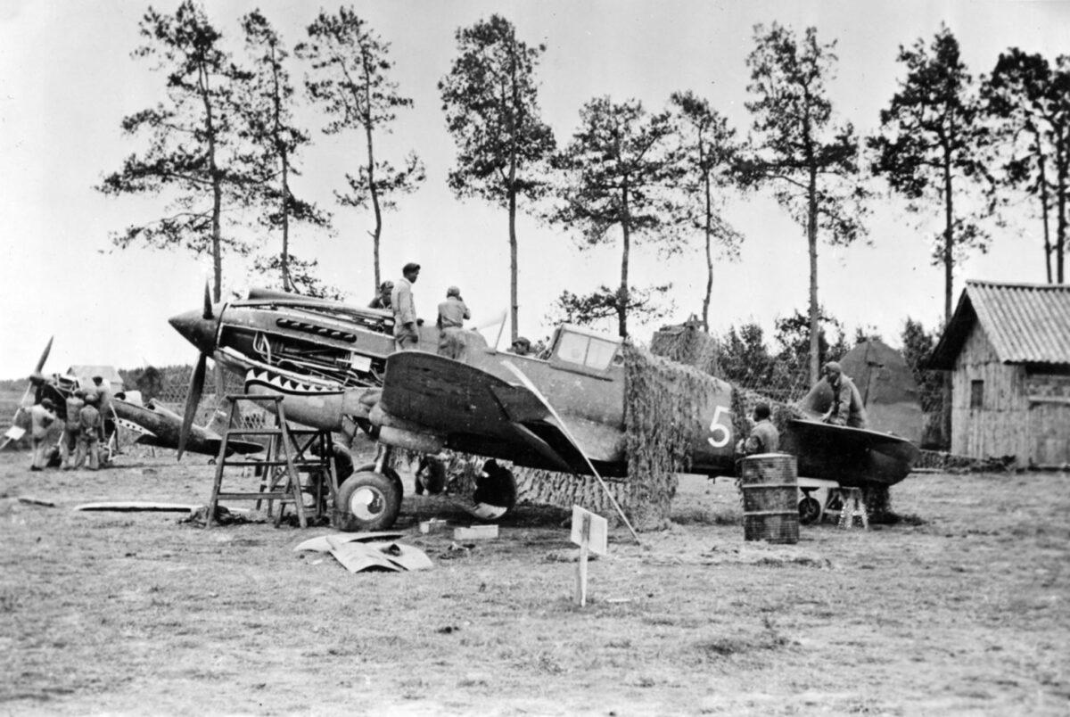 Aeronautical technicians repair a P-40 fighter