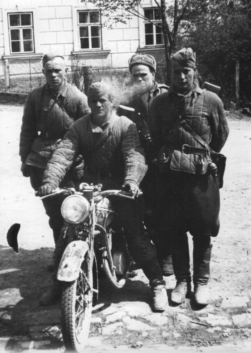 Soviet soldiers with a motorcycle