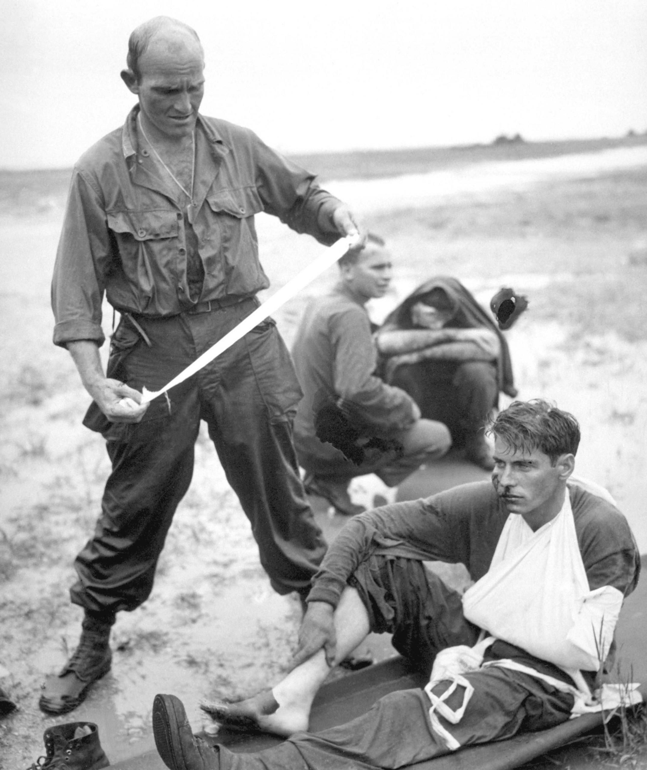 An American medic assists a wounded