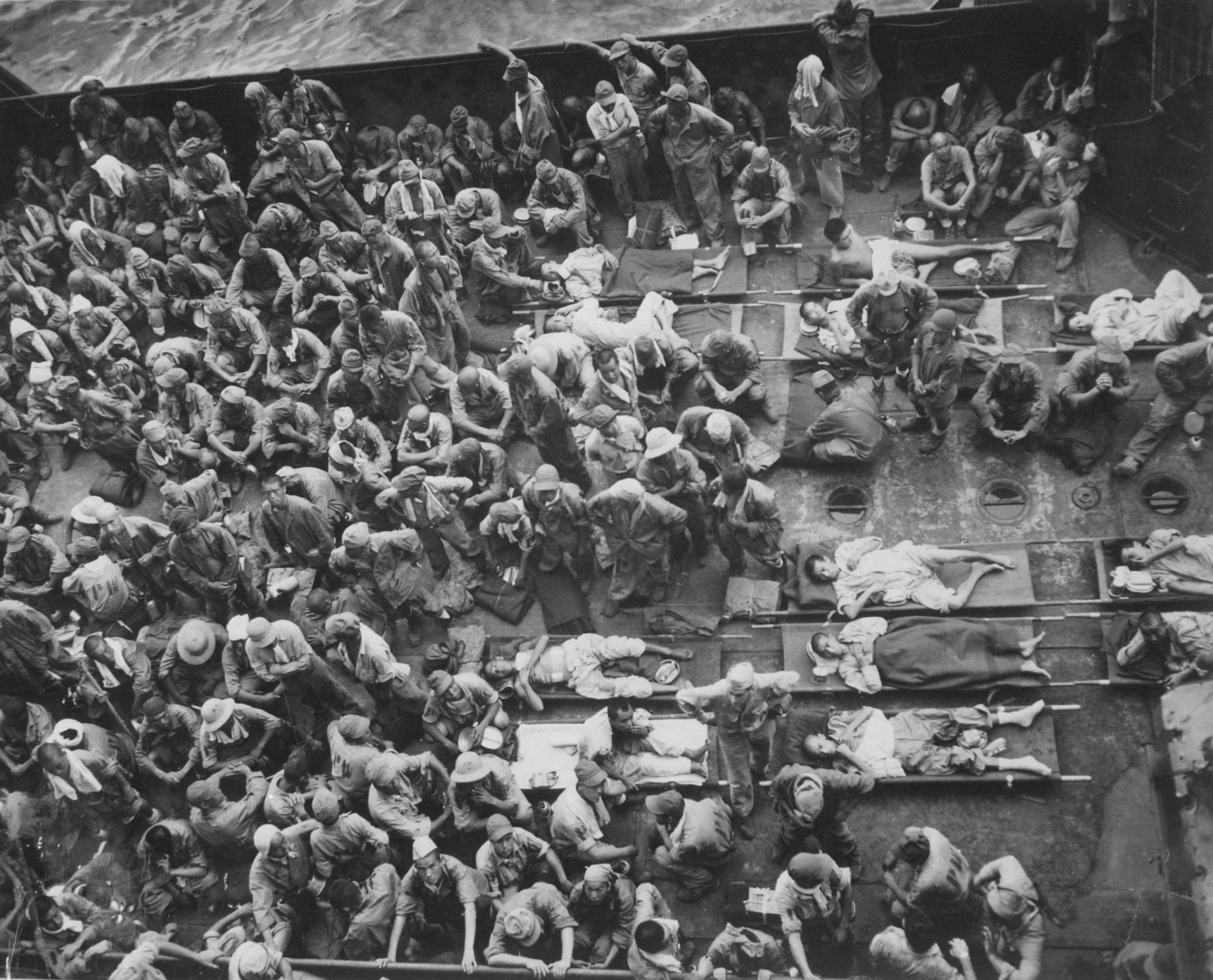 Japanese prisoners of war in the hold of a US Coast Guard transport ship